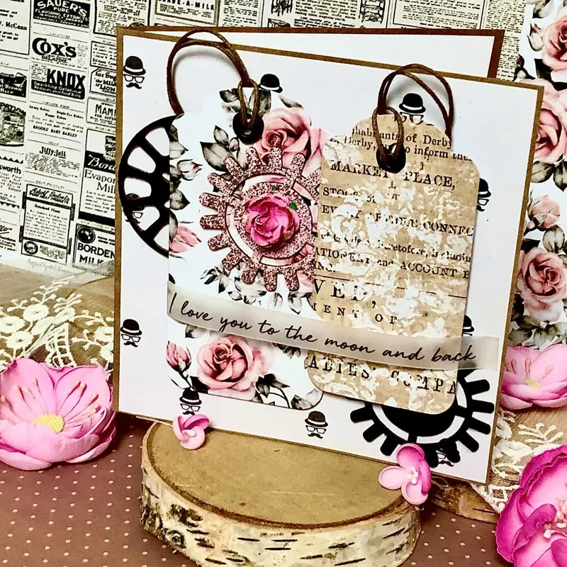 Ręcznie robiona kartka miłosna „Amor” w tonacji: złoto i beż, brąz, róż; wielowarstwowa kompozycja z papierowymi kwiatami i złoconymi detalami